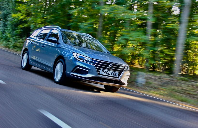 MG 5 EV estate electric car exterior front driving in woods